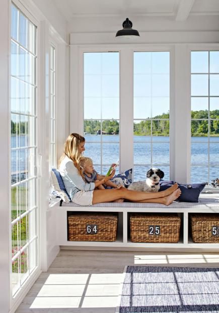 What a sunroom! A beautiful view from a Michigan cottage, plus ample storage for games and books from the 14-foot window seat’s cubby baskets. More photos from this home: http://www.midwestliving.com/homes/featured-homes/house-tour-lake-house-effect?page=1 Pool Sunroom, Michigan Cottage, Bay Window Seat, Sunroom Ideas, Sunroom Designs, Lake Cottage, Sunrooms, غرفة ملابس, Beach Cottage Style