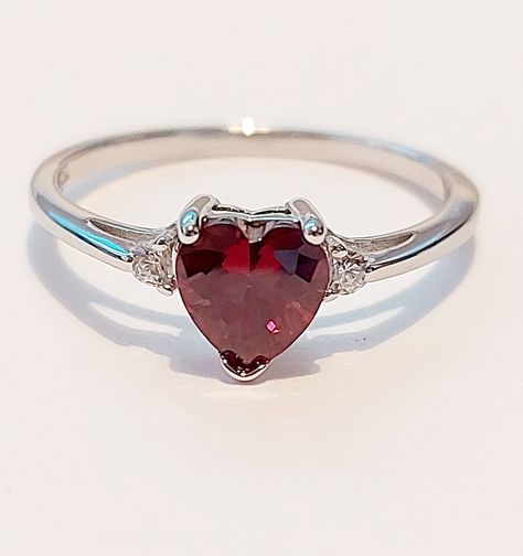 VALENTINES GIFT STERLING SILVER HEART ENGAGEMENT RING GARNET HEART  Face Height: 7 mm Band Width: 2 mm Stone: Garnet / Clear CZ post out in a free little gift box  nb;  Garnet is synthetic but very beautiful Valentines Promise Ring, Red Heart Ring, White Gold Ruby Ring, Ruby Heart Ring, Heart Engagement, Silver Promise Rings, Garnet Ring Silver, Garnet Heart, Dark Jewelry