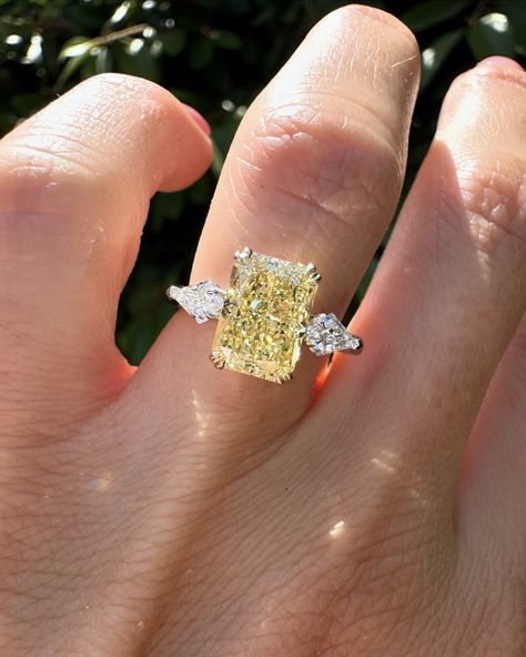 Swipe for more angles of this stunning yellow Radiant cut. 2.57ct yellow radiant cut diamond with kite side stones set in 14k yellow gold & platinum. #radiantcut #radiantcutdiamond #radiantcutdiamond #engagementring #diamondring #proposal #showmeyourrings #gettingmarried #howtheyasked #bridetobe #theknotrings #imengaged #theysaidyes #isaidyes #engaged #customjewelry #finejewelry Light Yellow Diamond Engagement Ring, Yellow Canary Diamond Ring, Wedding Ring Yellow Diamond, Yellow Topaz Engagement Ring, Kite Side Stones, Canary Engagement Ring, Engagement Ring Yellow Diamond, Canary Diamond Engagement Ring, Yellow Engagement Ring