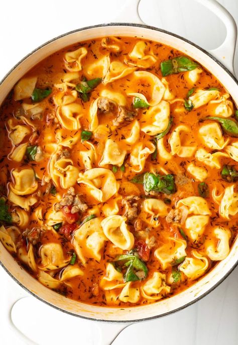 Top down view, pot of sausage soup with tortellini. Spicy Sausage Tortellini Soup, Spicy Italian Sausage Recipes, Easy Sausage Tortellini Soup, Tortellini Soup Recipes, 30 Minute Soup Recipes, Italian Sausage Tortellini, Italian Sausage Tortellini Soup, Crock Pot Tortellini, Italian Soup Recipes