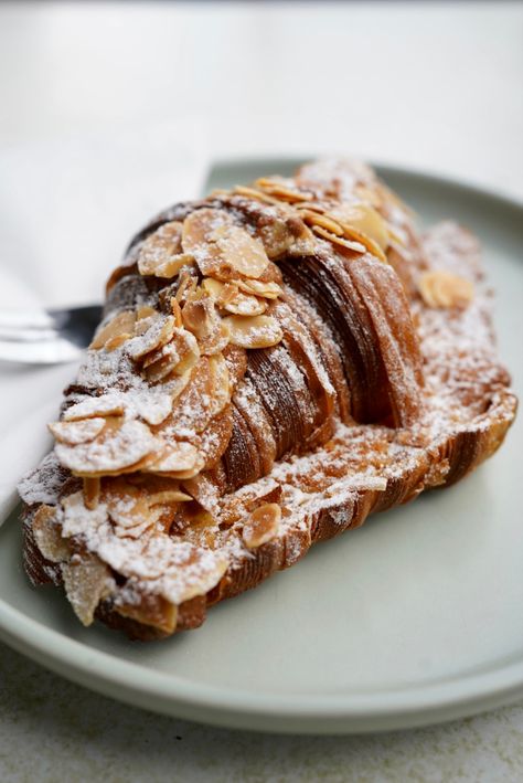 Light and airy photo of an almond croissant. Almond Croissant Aesthetic, Croissant Aesthetic, Pie Aesthetic, Almond Pie, Almond Croissant, Almond, Pie