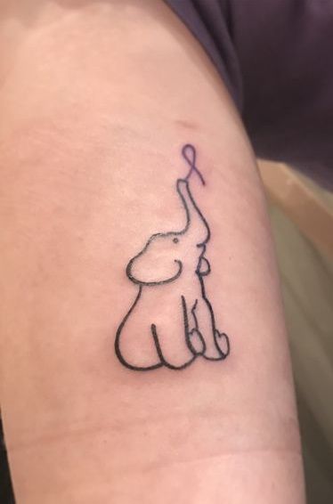 Elephant holding purple ribbon sleeve tattoo which is the sign of Alzheimer. Alzheimer’s Tattoo, Purple Ribbon Tattoos, Alzheimers Tattoo, Crohns Tattoo, Pink Ribbon Tattoos, Wild Goat, Survivor Tattoo, Alzheimer's Awareness, Hanya Tattoo