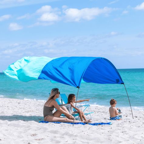 PRICES MAY VARY. NEW QUIET CANOPY: The new Shibumi Shade with Quiet Canopy has a softer, more pleasing sound at all wind speeds. The softer fabric with added stretch is also stronger, and significantly reduces loud flapping in high winds. SHIBUMI SHADE BEACH CANOPY: Beach time just got better with the Shibumi Shade. Ideal for groups of 1-2 people, the Shibumi Shade Mini provides 75 square feet of shade and UPF 50+ sun protection with room leftover for bags, coolers and beach gear. ORIGINAL WIND- Shibumi Shade, Beach Canopy, Beach Shade, Beach Adventure, Beach Hacks, Beach Gear, Shade Sail, Beach Umbrella, Ocean Breeze