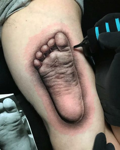 35 Trending And Meaningful Sweet Baby Feet Tattoo Designs - Psycho Tats Baby Foot Tattoo, Baby Feet Tattoo, Baby Feet Tattoos For Moms, Baby Hand And Foot Print Tattoo, Newborn Footprint Tattoo Ideas, Unique Footprint Tattoos, Tattoo Of Baby Foot Prints, Baby Feet Tattoos Footprint, Baby Footprint Tattoo