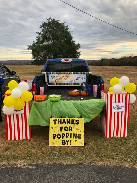 We used a cardboard box, white poster board and red duck tape for the popcorn boxes and yellow and white balloons tied together with kite string for popcorn. Popcorn Trunk Or Treat Ideas For Cars, Trunk Or Treat Concession Stand, Jesus Sweetest Name I Know Trunk, Trunk Or Treat Popcorn Theme, Pick Up Trunk Or Treat Ideas, Lets Taco Bout Jesus Trunk Or Treat, Truck And Treat Ideas, Trunk Or Treat Ideas For Trucks Church, Police Trunk Or Treat