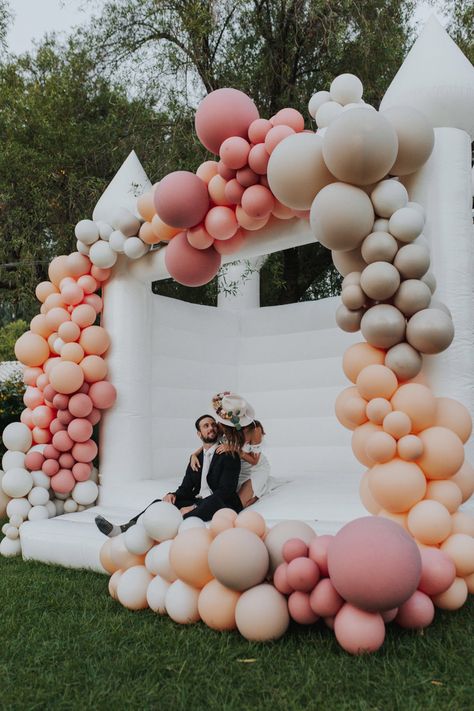 White Wedding bouncy castle with balloon arch from Inflate Forty Eight Wedding Bounce House, Wedding Balloon Arch, White Bounce House, Wedding Balloon Decorations, Bouncy House, Arch Kit, Wedding Balloons, Bounce House, Post Wedding