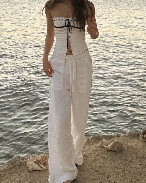 Women's Linen Summer Palazzo Trousers Flowy 2024 summer beach aesthetic cream beige white striped linen trousers outfit suggestions 2024 aesthetic summer evening outfit suggestions shopping suggestions For a chic summer evening look, consider pairing these linen palazzo trousers with a simple white camisole and a statement necklace. Add strappy sandals and a clutch bag to complete the outfit. This combination offers effortless elegance and is perfect for a night out or a special dinner on the be Trouser Summer Outfits, Linen Trousers Aesthetic, Beige Flowy Pants Outfit, White Linen Pants Outfit Dressy, White Camisole Outfit, Flowy Outfits Aesthetic, White Linen Trousers Outfit, Beige Linen Pants Outfit, Hawaii Looks