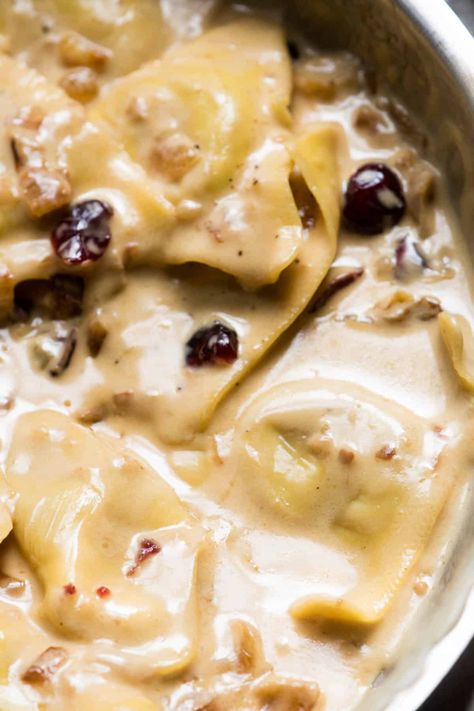 Ultimate fall comfort food! Tender butternut squash ravioli cloaked in rich marsala cream sauce with caramelized onions, dried cranberries and fresh sage. #hungerthirstplay #fallrecipes #comfortfood #pasta #ravioli #butternutsquashravioli #marsala #marsalacreamsauce #fall #autumn #creamypastadishes Marsala Cream Sauce Pasta, Cream Sauce For Butternut Squash Ravioli, Ravioli Sauce Healthy, Sauce For Butternut Squash Ravioli Cream, Sage Sauce For Ravioli, Butternut Squash Ravioli Cream Sauce, Butternut Squash Ravioli Recipes Sauces, Sauces For Butternut Squash Ravioli, Squash Ravioli Sauce