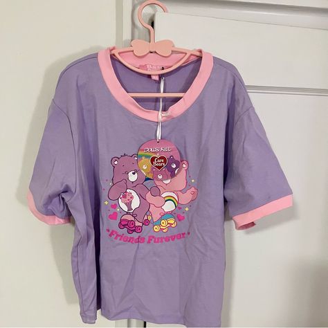 Nwt - Dolls Kill X Care Bears Best Of Buddies Purple/Pink Graphic Baby Tee - Xl Dolls Kill X Care Bears Best Of Buddies Graphic Baby Tee Because We're Gonna Be Friends Forever! This Lavender Baby Tee Features Short Sleeves, A Cropped Fit, Contrast Colored Pink Trim, And Cheer Bear & Share Bear Skating Together On The Front. Caption Says “Friends Furever”! Measurements: Chest - 38” Length - 18” Perfect For Spring! Carebear Outfits, Carebear Clothes, Care Bears Clothes, Care Bear Shirt, Purple Baby Tee, School Clothing, Cheer Bear, Funky Shirts, Graphic Baby Tee