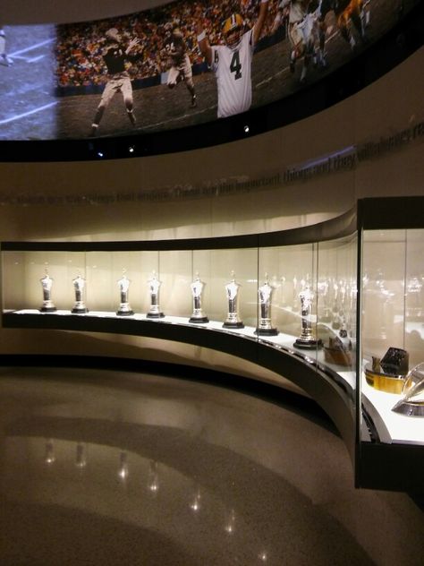 Epic Trophy Case. World Championships prior to Super Bowl Era. Trophy Rooms Awards, Trophy Room Ideas, Trophy Display Ideas, Nfl Trophy, Award Wall, Painted Trophies, Trophy Display Case, Trophy Wall, School Reception