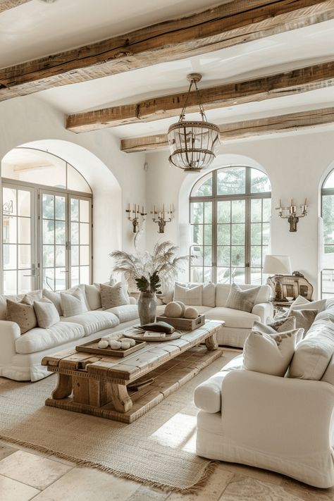 french farmhouse style living room with cream walls, cream sofa and cream bedding and rustic wood beams on the ceiling Farmhouse Living Room Wall Decor, Farmhouse Living Room Furniture, Farmhouse Living Room Decor Ideas, French Farmhouse Style, Farmhouse Style Living Room, French Farmhouse Decor, Modern Farmhouse Living, French Country Living Room, French Style Homes