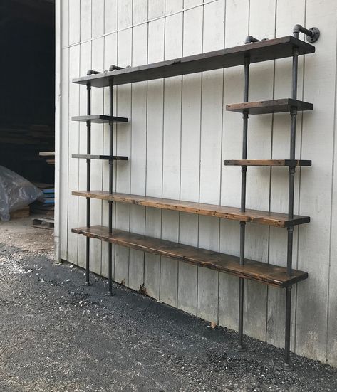 Black Pipe Shelves Office, Shelf Build In Top Of Wall, Fireplace Pipe Shelves, Pipe Shelves Library, Living Room Pipe Shelves, Gas Pipe Floating Shelves, Scaffold Tv Stand, Basement Bar With Tv Industrial, Short Tv Stand Styling