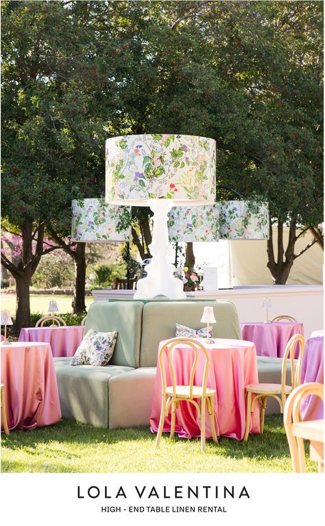 Create a beautiful baby shower, bridal luncheon, mother's day, wedding reception, garden party, or birthday with this garden pattern lamp shade and oversized lamp decor. Pink glassware, Orchid and Apricot Linens, fresh garden flowers, and custom pattern vinyl wrap bar and decor. Table Linens create a retro chic aesthetic reminiscent of classic garden or lawn parties. Contact us at design@lolavalentina.com and we will give you all of the information you need to get started designing your event! Garden Chic Wedding Decor, Rose Garden Theme Party, Shades Of Pink Decor, Farm To Table Decor, Oversized Lamp, French Garden Party, Pastel Garden Party, Wedding Reception Garden, English Garden Party