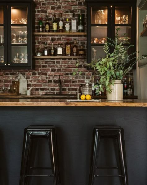 ELYSE MCCURDY | HOME DESIGNS on Instagram: "Continuing on with the topic of basements: pictured here is our bar setup. We might have a modest square footage above grade but we sure make up for each square footage below grade too! As I have mentioned before, square footage is a personal topic - we see these ginormous homes on social media and for most that just isn’t our reality. While I love looking and dreaming -- (even designing them for others!) but when it came to designing and building my Home Bar Renovation Ideas, Basement Moody Bar, Basement Bar Back Wall, Basement Bar With Brick Wall, Basement Home Bar Ideas, Dark Moody Basement Ideas, All Black Basement, Moody Bars, Moody Bar Design