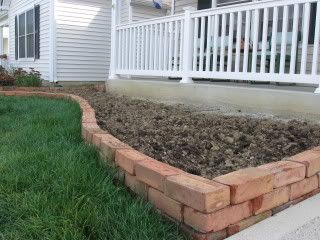 I like the idea of having a brick border along the fences - It can be straight or wavy like this photo. Brick Landscape, Brick Flower Bed, Cascading Plants, Brick Border, Brick Garden Edging, Garden Border Edging, Brick Edging, Diy Garden Bed, Brick Garden