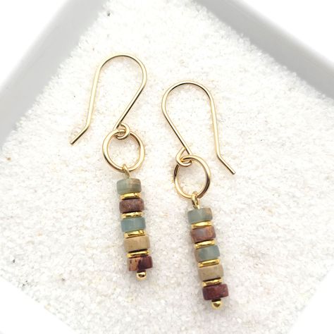 Minimalist style with these 14k gold filled earrings with Aqua Terra jasper beads * Earrings are made from quality 14k gold filled wire, they measure approximately 1.5" in length. * Polished to a high shine * Sent in a Gift Box with Polishing Cloth * Handmade in Montana Wooden Bead Earrings, Earrings Handmade Boho, Bijoux Fil Aluminium, Plastic Pouch, Aqua Terra, Wire Jewelry Designs, Gold Dangle Earrings, Beads Earrings, Earrings Inspiration