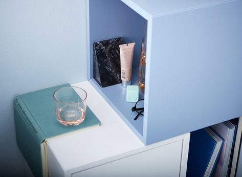 A DIY bedside table setup made of cubic cabinets that hold some cosmetic tubes, a pair of spectacles and a glass. Floating Nightstand Ikea, Nightstand Hack, Diy Bedside Table, Diy Bedside, Ikea Nightstand, Traditional Bedside Tables, Ikea Eket, Small Bedside, Cabinet Fronts