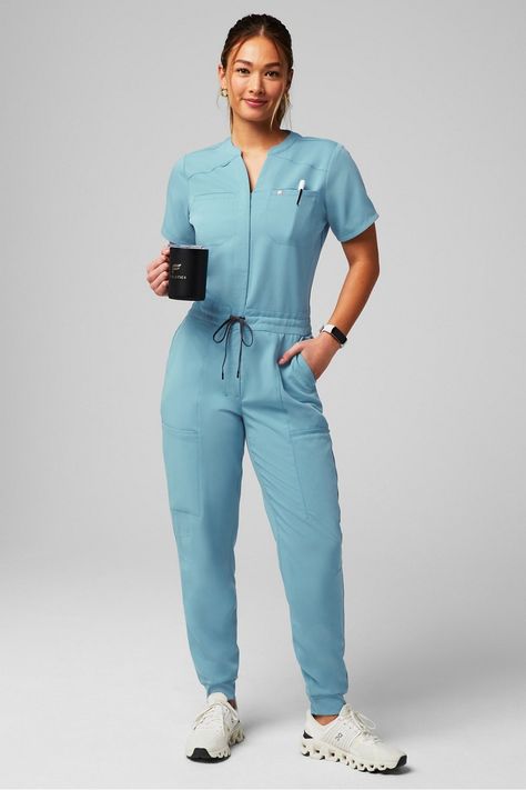 Empower Scrub Jumpsuit - Yitty Dentist Scrubs Woman, Female Doctor Photoshoot, Nurses Scrubs Outfits, Nurse Style Scrubs Fashion, Scrubs Jumpsuit, Scrubs Uniform Aesthetic, Doctor Outfit Ideas, Scrub Outfit Ideas, Scrubs Uniform Cute Fashion Styles