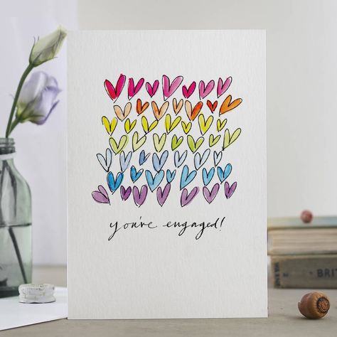 Shower the happy couple with a rainbow of hearts. Celebrate the newly betrothed couple with this fun rainbow You're Engaged card!The illustration was originally drawn by hand with a dip pen, inks and watercolour paints. The modern calligraphy was drawn with an old dip pen and Indian ink.Carbon-neutral print on FSC-accredited art board in a solar powered warehouse. Plastic bottles are banned from the office!Blank inside. You can choose to personalise the card with your special message written in Hand Drawn Cards, Watercolor Paintings For Beginners, Rainbow Card, Newly Engaged Couple, Neutral Prints, Dip Pen, Engagement Cards, Heart Cards, Heart Wedding