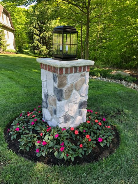 Finally we're thinking SPRING 🌷 Have you planted your flowers for the season yet? #madeinusa #curbappeal #homedecor #exteriordesign #howyouhome #architecturaldigest #lightingdesign #outdoorlighting #homeinspo  #homeinspiration  #homeideas #designinspiration #homeexterior #remodeling #TowerLighting #outdoorliving #outdoorspace #luxurydetails #frontporchliving #frontporchdecor #instadesign #lightingstyle #exteriorsofinstagram #thinkspring #postlights #plantflowers #lantern #homebeautful Brick Pillars, Driveway Entrance Landscaping, Driveway Lighting, Outdoor Lamp Posts, Tower Light, Lantern Post, Home Garden Design, Home Landscaping, Hus Inspiration