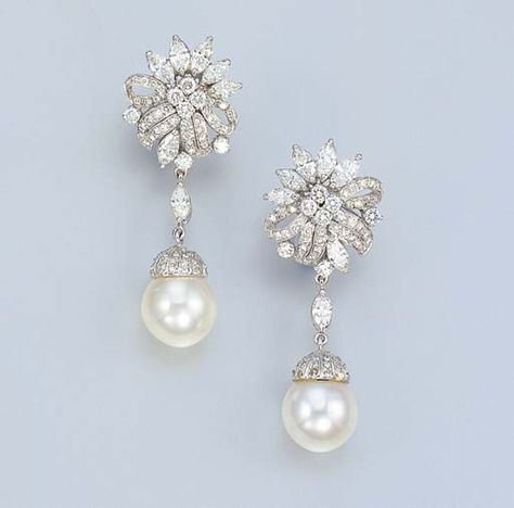 A PAIR OF SOUTH SEA CULTURED PEARL AND DIAMOND EAR PENDANTS    Each set with a cultured pearl measuring approximately 12.06 x 11.20 and 12.21 x 11.10 mm, to the diamond cupola and marquise-cut diamond surmount, suspended from a diamond floral top, mounted in 18k white gold (one diamond deficient), 5.1 cm long Unique Pearl Earrings, Fine Pearl Jewelry, Neck Pieces Jewelry, Wedding Bride Jewelry, Pearl Necklace Designs, Pearl And Diamond Earrings, Anniversary Jewelry, Gold Earrings Designs, Fabulous Jewelry