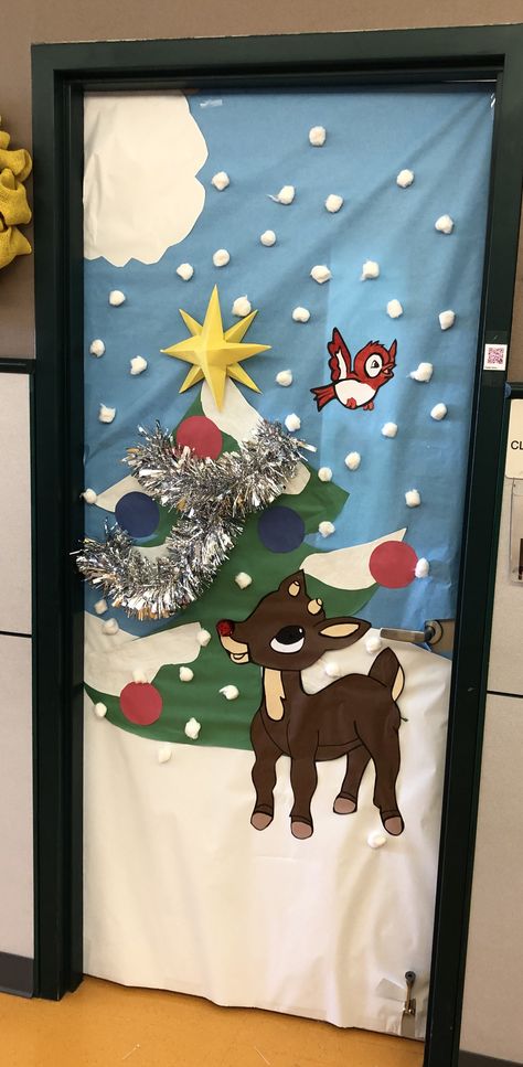 Christmas class door - Rudolph the Red Nosed Reindeer 🎄❤️ Rudolph The Red Nosed Reindeer Office Decor, Rudolph The Red Nosed Reindeer Bulletin Board Ideas, Rudolph Office Christmas Decorations, Rudolf Door Decorating, Reindeer Door Decoration Christmas, Christmas Door Decorating Contest Movie Theme, Rudolph The Red Nosed Reindeer Decorations, Rudolph The Red Nosed Reindeer Bulletin Board, Rudolph The Red Nosed Reindeer Classroom Door Decoration