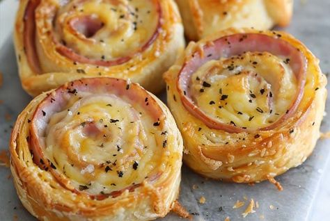 Discover the art of making Ham and Cheese Pinwheels with our simple guide. Perfect for parties, these snacks are sure to impress your guests! Pin Wheel Recipes Ham And Cheese, Hot Ham And Cheese Pinwheels, Baking Appetizers, Creamed Ham, Making Ham, Ham Cheese Pinwheels, Easy Breakfast Casserole Sausage, Ham Pinwheels, Ham And Cheese Pinwheels