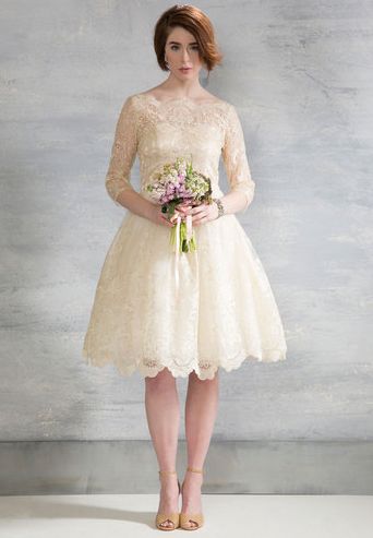 Short and sweet, this gorgeous knee-length dress is an excellent pick for brides who want to dance all night long without getting tangled in a long, elaborate train. Gilded Grace Dress in Champagne ($175, Modcloth.com) Simple Romantic Wedding Dress, Simple Romantic Wedding, Modcloth Wedding Dress, Chi Chi London Dress, Retro Wedding Dresses, Wedding Dress Short, Short Lace Wedding Dress, Romantic Wedding Dress, Vintage Style Wedding Dresses