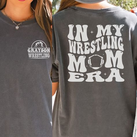 "Wrestling Mom Era Comfort Colors Shirt is the perfect gift for any wrestling mama this Christmas! Makes a great Mother's Day or Birthday Gift as well!  In the personalization box, enter the name you would like on your shirt. (Ex: Grayson) This shirt runs true to size.  If you want an oversized look, please order one size up.  If you want the oversized dress look, please size up two sizes. This is made with a 1717 Comfort Colors, garment-dyed t-shirt. Made with 100% ring-spun cotton, soft-washed Wrestling Mom Shirts, Youth Wrestling, Wrestling Gift, Sports Mom Gifts, Moms' Night Out, Wrestling Mom, Wrestling Shirts, Mom Era, Brother Shirts