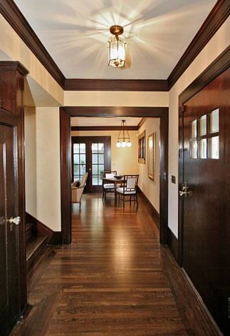 Tudor Style Bedrooms | The entryway at 822 Mendocino Ave. in Berkeley. The Tudor-style home ... White Walls Dark Brown Trim, Interior Door Colors, Dark Wood Trim, Bungalow Ideas, Stained Trim, Living Room Wood Floor, Dark Trim, Tudor Style Homes, Light Wood Floors