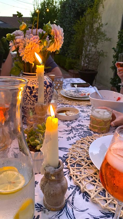 Outdoor dinner party, candles, floral, blue, coastal geandmother, spritz Coastal Party Theme, Dinner Party Candles, Outdoor Dinner Party, Bday Dinner, Italian Dinner Party, Coastal Fall, Round Table Decor, Outdoor Dinner Parties, Dinner Party Themes