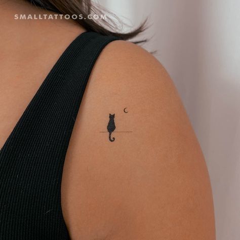 Minimalist style standing black cat staring at the moon temporary tattoo. For some people, our black cat staring at the moon temporary tattoo is synonymous with Halloween and scary movies. But they may not realize that the connection between cats and the moon is actually thousands of years old! For those who understand this symbolism, our sustainable black cat staring at the moon fake tattoo is a thought-provoking way to connect with feminine energy. Since ancient times, cats have been associated with mystery and magic and are often seen as symbols of the lunar cycle. Similarly, the moon is considered a feminine force, and cats are thought to be connected to this energy. Our black cat and crescent moon adhesive tattoo can be seen as a protective or lucky design. Many people find the idea o Ghost And Black Cat Tattoo, Black Cat On Moon Tattoo, Hidden Cat Tattoo, Black Cat Minimalist Tattoo, Ankle Cat Tattoo, Black Cat Tattoos For Women, Tiny Black Cat Tattoo, Cat Star Tattoo, Black Cat Silhouette Tattoo