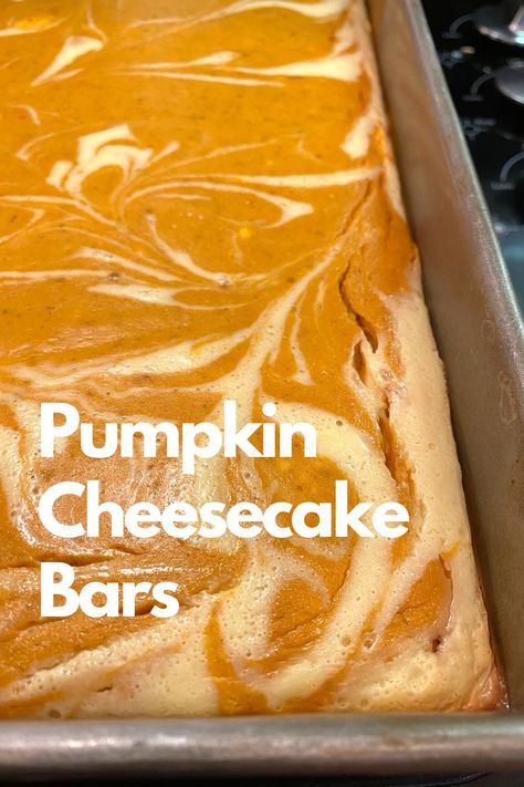 A baked pan of pumpkin cheesecake bars. Creamy Pumpkin Pie Bars, Pumpkin Bars 9x13 Pan, Pumpkin Swirl Cheesecake Bars, Pumpkin Cheesecake Bars Easy, Pumpkin Bars With Cream Cheese Frosting, Pumpkin Cheesecake Bar, Pumpkin Cheesecake Swirl, Pumpkin Dessert Bars, Pumpkin Pie Cheesecake Bars