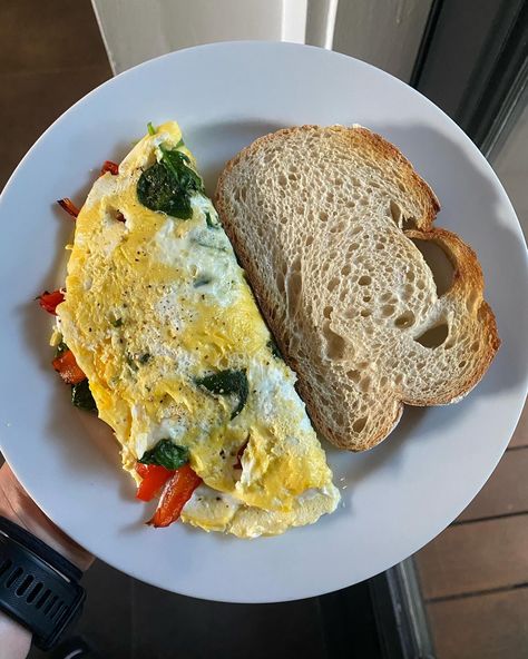 my breakfast ❤️ A fluffy omelet made with one whole egg, two egg whites, and a handful of spinach, filled with a creamy goat cheese spread (10ml whole milk, 25g goat cheese) and topped with roasted bell peppers. Served with a slice of sourdough on the side. 🤌 #breakfast #healthybreakfast #breakfastideas #omlet #highprotein #highproteinbreakfast #lifestyle #healthy #healthyfood #healthylifestyle #live #love #eggs #realfood #eatclean #lunch #healthyrecipes #delicious #yummy #gym #fit #motivat... Goat Cheese Spread, Field Meals, Roasted Bell Peppers, Veggie Omelet, Creamy Goat Cheese, My Breakfast, High Protein Breakfast, Cheese Spread, Whole Eggs