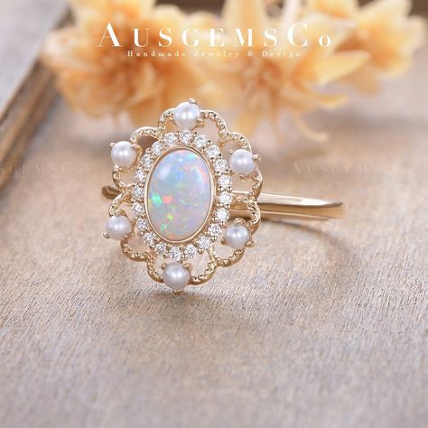 **All rings are handmade and shipped in Australia. If you don't like the stone in the picture, please contact me to get the custom service. Check the best seller flora bridal set: With moissanite: https://www.etsy.com/listing/871140689 With lab opal: https://www.etsy.com/listing/974614330 🌸ITEM Details Main Stone: Natural Opal, 5*7mm, Oval Cut Accent Stone: Moissanite, DEF Color, VVS-VS Clarity, 0.13ct total Ring Band: 1.6mm  Metal Choice: 10K/14K or 18K Solid Gold (Rose, White, or Yellow)   Please note, the matching jewelry shown in the listing can be purchased separately. But AUSGEMSCo recommend purchasing the engagement ring and wedding band at the same time to ensure a perfect fit.  🌸Order & Rush Order *  Every single piece of AUSGEMSCo jewelry is made to order, and our standard prod Wedding Ring Pearl, Pearl Wedding Ring, Vintage Opal Engagement Ring, Engagement Ring Antique, Ring Pearl, Pearl Engagement Ring, Opal Wedding, Opal Engagement Ring, Opal Band