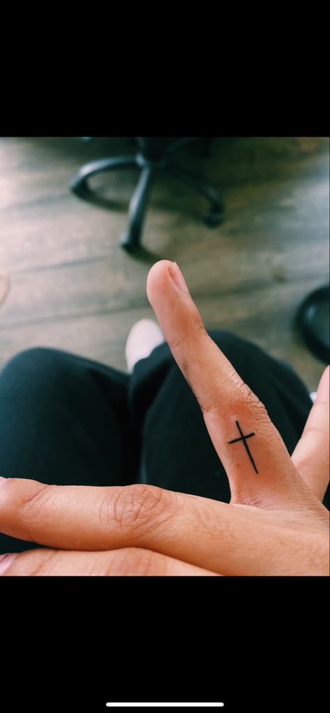 cross tattoo Cross On Inside Of Finger, Small Cross On Finger Tattoo, Tiny Cross Finger Tattoo, Red Cross Finger Tattoo, Cross On Middle Finger Tattoo, Small Cross Finger Tattoo, Small Cross Finger Tattoos For Women, Cross Finger Tattoo Men, Cross Ring Finger Tattoo