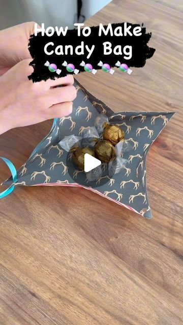 Shreeja Singh on Instagram: "DIY Candy 🍬 Bag 😃….." Cute Christmas Packaging Ideas, How To Wrap A Basket With Wrapping Paper, Wrapping Bath And Body Works Gifts, Candy Gift Bags Ideas, How To Tie A Bow On A Gift Bag, Halloween Paper Bags Diy, How To Wrap A Bowl As A Gift, Diy Candy Bags, Halloween Candy Bag Ideas