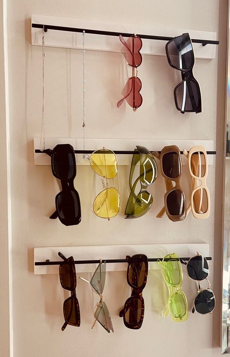 Small spaces means time to get creative with storage! Why not put some fun items on display? Sunglass Storage Wall, Eye Glass Storage Ideas, Sunglasses Wall Display, Sunglass Storage Ideas, Sunglasses Storage Ideas, Glasses Storage Ideas, Organizing Sunglasses, Sunglasses Display Diy, Sunglasses Organization