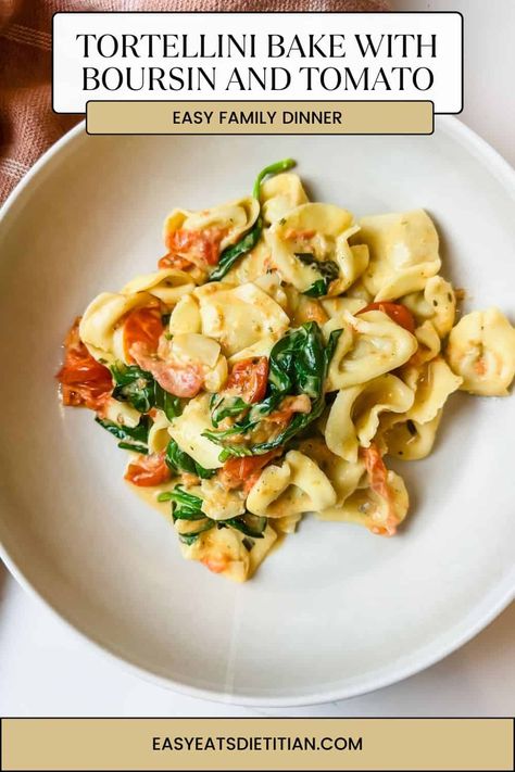 This easy tortellini bake is an upgrade from your standard baked tortellini recipe. Bake herby Boursin cheese with cherry tomatoes, then toss in fresh spinach and tortellini for hot, delicious comfort food. #tortellinibake #bakedtortellini #easydinner #weeknightdinner #fallrecipes #winterrecipes #comfortfood #easydinnerideas Easy Tortellini Bake, Easy Carrot Souffle Recipe, Spinach And Tortellini, Baked Tortellini Recipes, Boursin Pasta Recipe, Hearty Pasta Recipes, Boursin Cheese Recipes, Easy Tortellini, Baked Tortellini