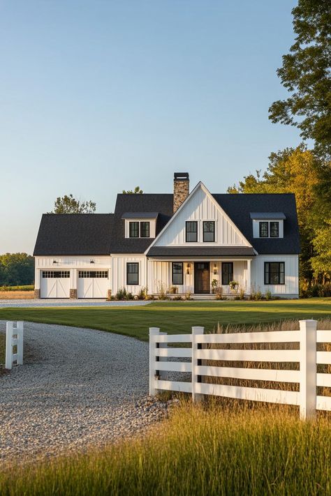 Wide angle view of a modern farmhouse exterior in white board and batten siding black multi pitched roof with dormers brown stone chimney detached. Check out all of these dream farmhouses that will have you drooling with rural living fantasies and mooing with joy! White Rustic Farmhouse Exterior, Farmhouse Dormers Exterior, White Ranch Style House Exterior Black Trim, Farmhouse Black And White Exterior, Farmhouse Exterior Board And Batten, White House Black Trim Wood Accents Exterior Farmhouse, White Barn House Modern Farmhouse, Modern Farm Homes Exterior, Renovated Farmhouse Exterior