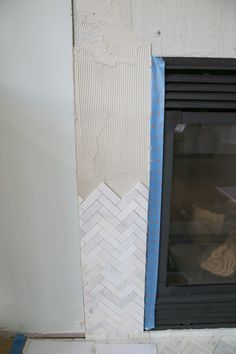 Fireplace Tile Trim, Diy Tile Fireplace Surround, How To Tile A Fireplace, Diy Tile Fireplace, Marble Herringbone Fireplace, Large Tile Fireplace, Herringbone Fireplace Surround, Herringbone Tile Fireplace, Tile Fireplace Surround