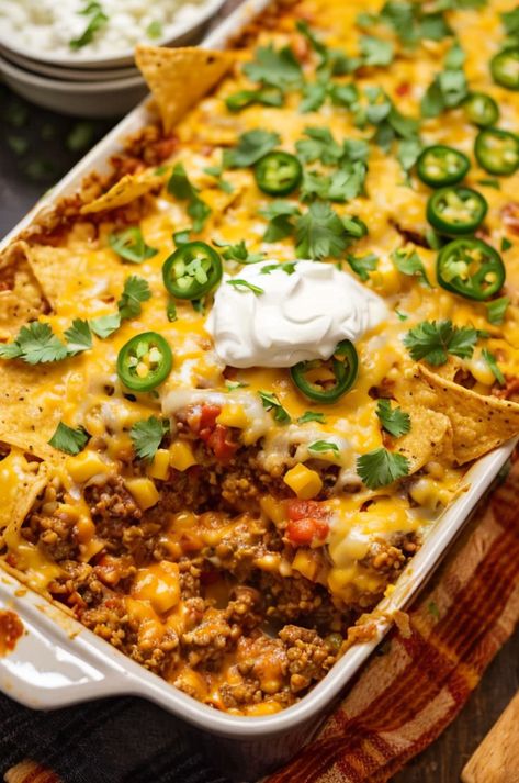 "Try our easy and delicious Walking Taco Casserole, made with layers of seasoned ground beef, cheese, and crispy tortilla chips. Perfect for family dinners! #tacotuesday #casserole #familydinner" Taco Meat Rice Casserole, Queso Casserole Ground Beef, Beef And Bean Taco Casserole, Taco Casserole Bake With Tortilla Chips, Taco Crunch Wrap Casserole, Tortilla Chip Casserole Beef, Easy Taco Casserole Recipes, Taco Casserole Bake With Tortillas, Taco Pie With Tortillas