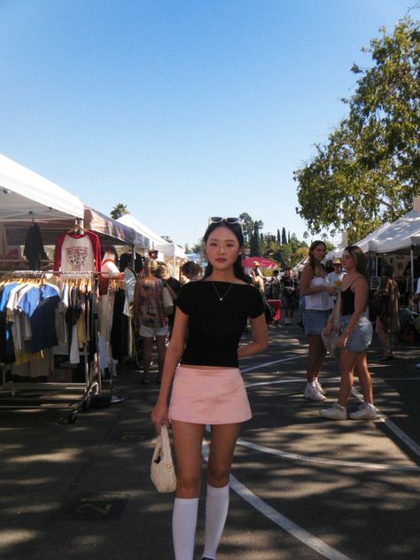 los feliz flea market fit, black top, pink satin mini skirt, open back top, knee high socks, adidas samba, miumiu bag, digicam, digital camera, retro aesthetic, y2k, asian, korean fashion Pink Top Black Skirt Outfit, Pink Satin Mini Skirt Outfit, Knee Socks Outfits Summer, Black And Pink Sambas Outfit, Short Pink Skirt Outfit, Pink Satin Mini Skirt, Pink Miniskirt, Knee High Socks Outfit Summer, Black Knee High Socks Outfit