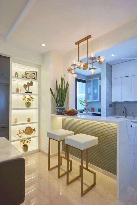 Have a look at this beautiful marvelous kitchen & breakfast counter. Everything is so well presented and falls in its place perfectly. The Contemporary Chandelier, Wall Cabinet & Chairs complement each other to the overall ambiance. 📍 Lodha, The Park Follow @tanujaandassociates for more ideas. . . #tanujaandassociates #interiordesigner #mumbailife #luxuriouslifestyle #luxuryinteriors #kitchendesign #kitchendecor #eatinkitchen #kitchenmakeover #modularkitchen Luxury Breakfast Counter Design, Breakfast Counter With Crockery Unit, Brakefast Counter Design, Breakfast Counter Chairs, Breakfast Counter Lights, Breakfast Counter In Kitchen Modern, Breakfast Counter Design, Breakfast Counter In Kitchen, Breakfast Counter Ideas