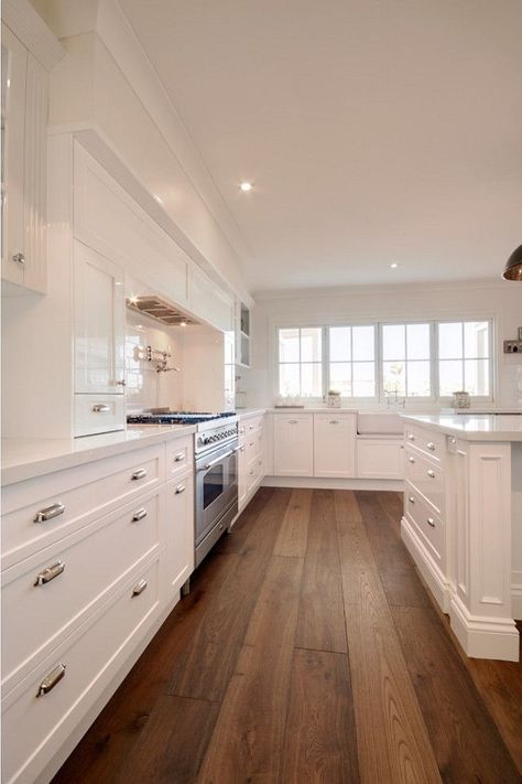 Clean white kitchen design with wood floor Luxury White Kitchen Design, Luxury White Kitchen, Hardwood Plank Flooring, Timeless Kitchen Design, Wood Floor Kitchen, Hardwood Floors Dark, Kabinet Dapur, Wood Floors Wide Plank, Timeless Kitchen