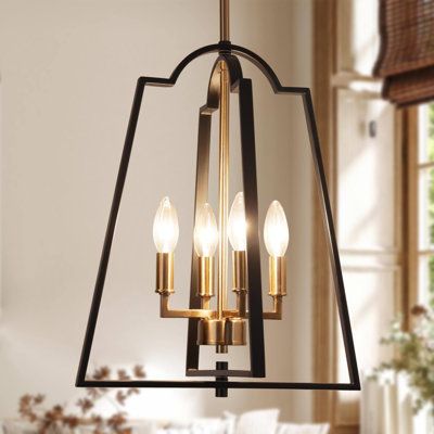 Introduce a modern but classic lantern appeal to your home with this glamorous 4-light chandelier. The stunning combination of matte black and dark gold finish highlights its open lantern frame and makes it an impressive art piece for your space. Four gold candle-shaped bulb sockets made of premium metal add a sense of traditional charm that can go well with your modern or farmhouse decor. | Everly Quinn Marval 4-Light Lantern Classic Chandelier Metal | 17.5 H x 14 W x 14 D in | Wayfair Chandelier Above Tub Bathroom, Black And Brass Chandelier Entryway, Small Black Chandelier Bathroom, Black Semi Flush Ceiling Lights, Black Entryway Light Fixture, White Black Gold Kitchen, Bronze Kitchen Light Fixtures, Black And Gold Pendant Light Kitchen, Black And Gold Light Fixture