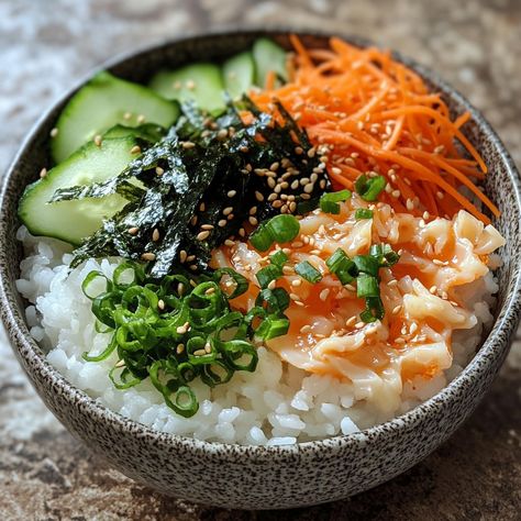 🍚 Enjoy the vibrant Albap, a fish roe rice bowl that's bursting with flavors! 🐟🍚 #KoreanFood #HealthyEats #FishRoe Albap (Fish Roe Rice Bowl) Ingredients: Cooked rice (2 cups) Fish roe (100g) Mixed greens (1 cup) Carrots (1/2 cup, julienned) Cucumber (1/2 cup, julienned) Seaweed strips (1/4 cup) Sesame oil (1 tbsp) Soy sauce (2 tbsp) Sesame seeds (1 tbsp) Green onions (2, chopped) Instructions: Place cooked rice in a bowl. Arrange fish roe, mixed greens, carrots, cucumber, and seaweed str... Rice With Seaweed, Seaweed Chips, Bowl Ingredients, Fish Roe, Pescatarian Diet, Instagram Recipes, Cooked Rice, Coconut Rice, Trending Recipes