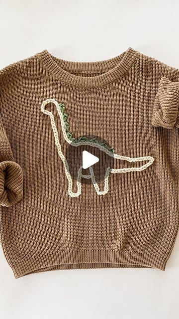 Sarah - DIY Embroidery Kits & Patterns on Instagram: "Made this sweater for my little boy! I don’t think I ever shared how I got the Dino pattern onto the sweater. Basically I drew a Dino and then cut it out creating a stencil of sorts. Then I traced it onto the sweater 🦕   If you want to learn to embroider on a sweater, comment “sweater stitch along” and I’ll DM you the link for my virtual class. It  will teach you how to make one of those cute name sweaters using a pattern that’s says “hello” - but you could totally take what you learn and embroider a dinosaur or flower or whatever you want 🫶🏻" Little Boy Embroidery Ideas, Boy Embroidered Sweater, Boys Embroidered Sweater, Sweater Embroidery Diy, Racoon Embroidery, Boy Embroidery Ideas, Boys Embroidery Designs, Sweater Embroidery Ideas, Embroidery For Boys