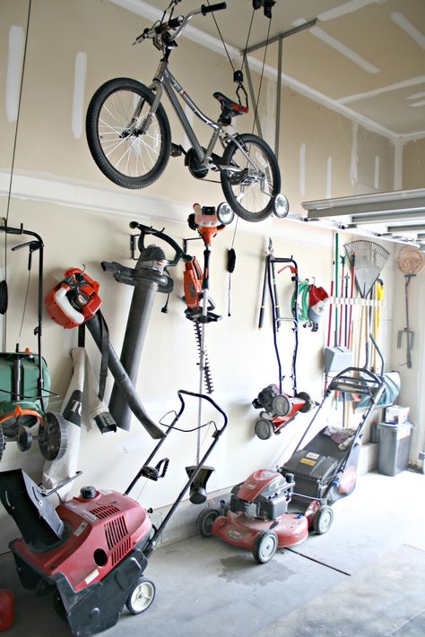 Storing Bikes In Garage, Lawn Equipment Storage, Lawn Mower Storage, Garage Tool Organization, Metal Storage Racks, Garage Organization Diy, Lawn Tools, Garage Accessories, Metal Artwork Wall