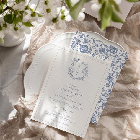 Formal & elegant crest monogram dusty blue wedding invitation with delicate rose flower pattern on the back. Wedding Invitation With Monogram, Dusty Blue Wedding Details, Wedding Invitations Blue And White, Blue Willow Wedding, Light Blue Wedding Invitations, Wedding Crest Monogram, Save The Date Floral, Classic Blue Wedding, Dusty Blue Wedding Invitation